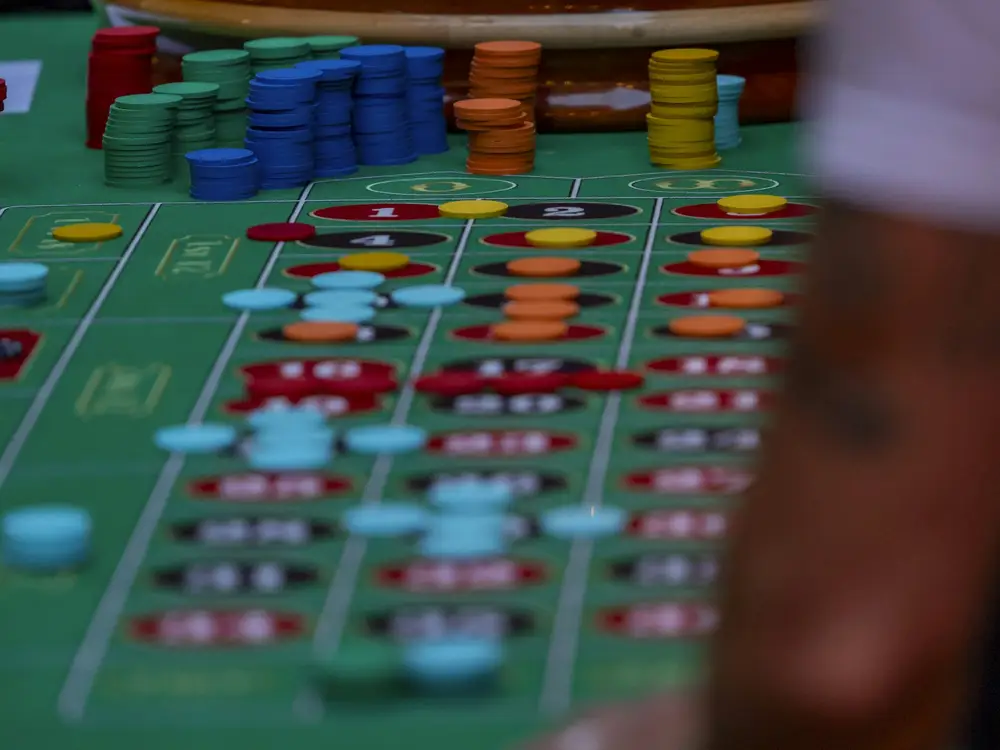 Chips stacked on a roulette table during a live casino game